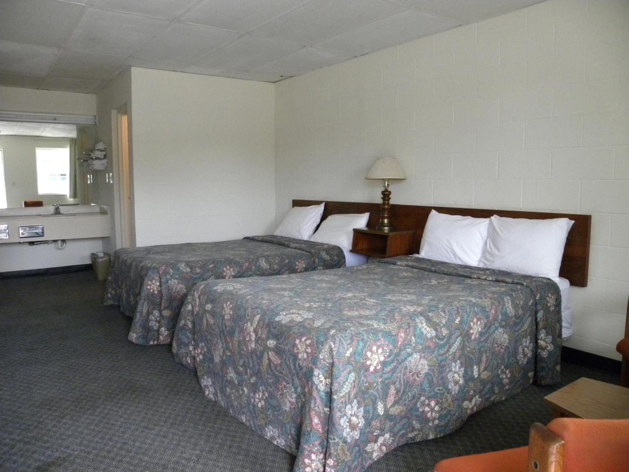 Guest Inn Rogers Bagian luar foto