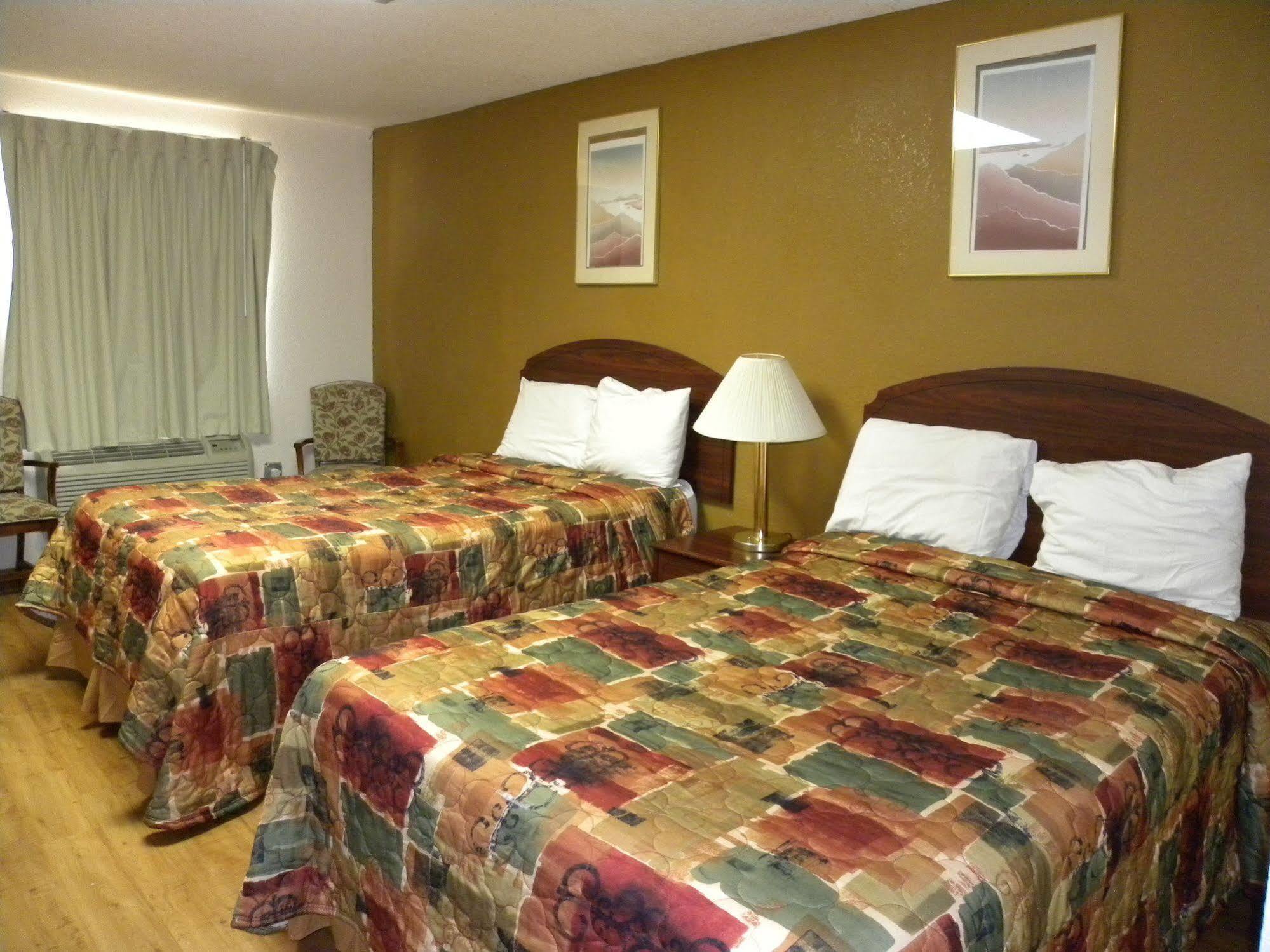 Guest Inn Rogers Bagian luar foto