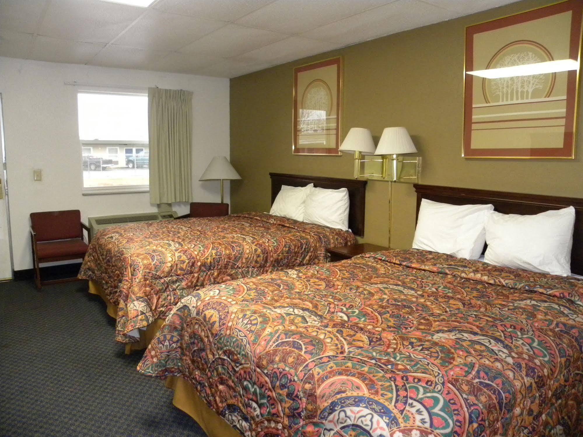 Guest Inn Rogers Bagian luar foto
