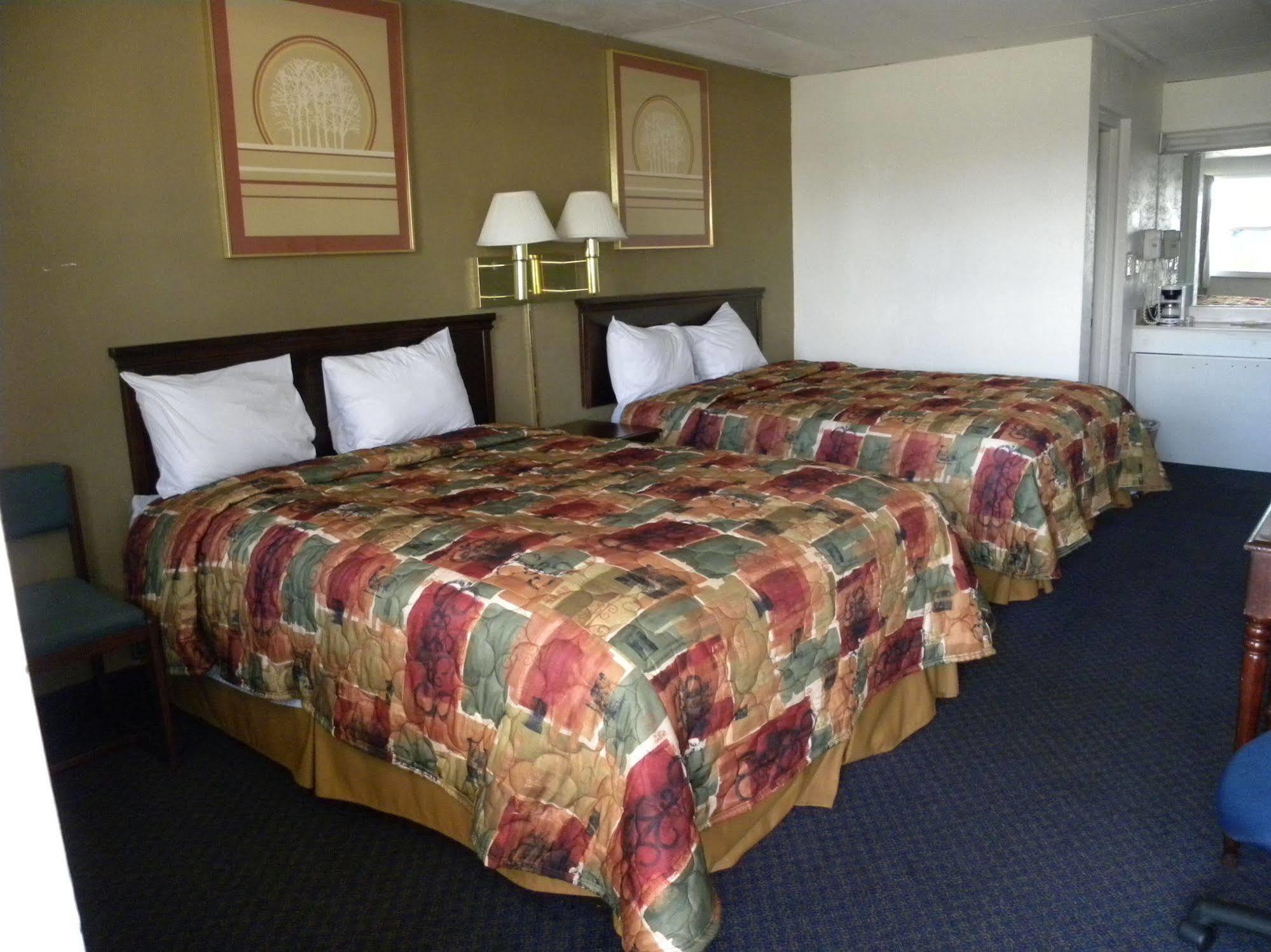 Guest Inn Rogers Bagian luar foto