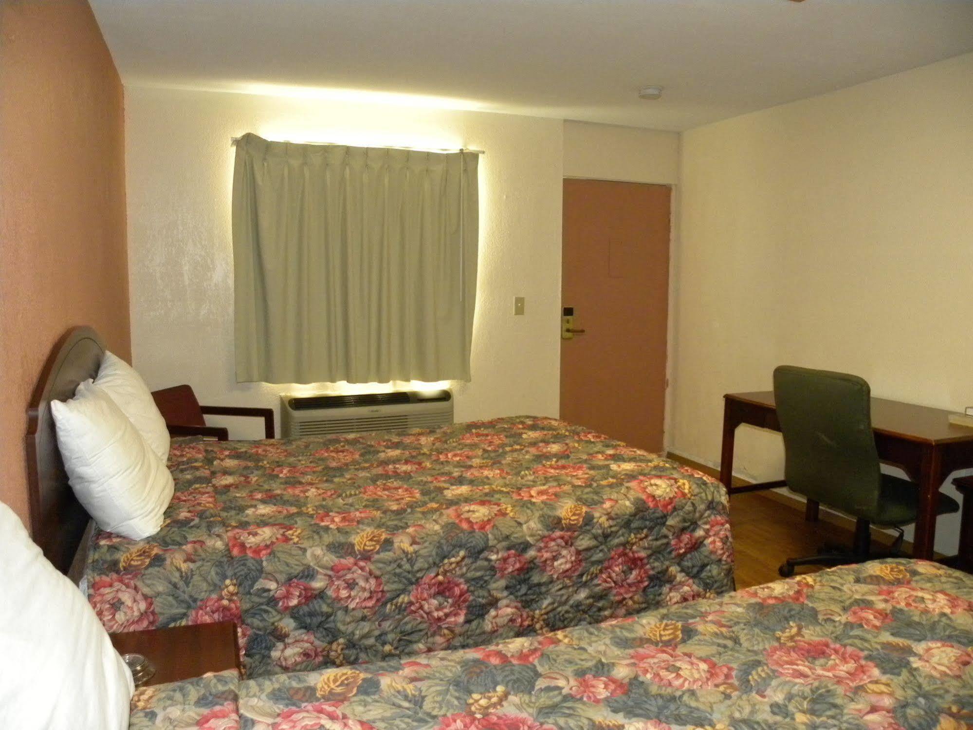 Guest Inn Rogers Bagian luar foto